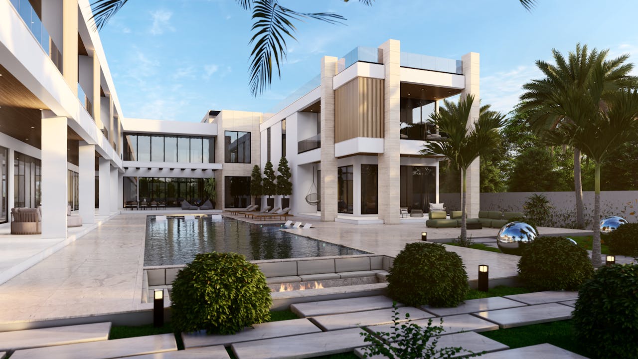 Elegant modern mansion featuring a luxurious pool surrounded by palm trees.